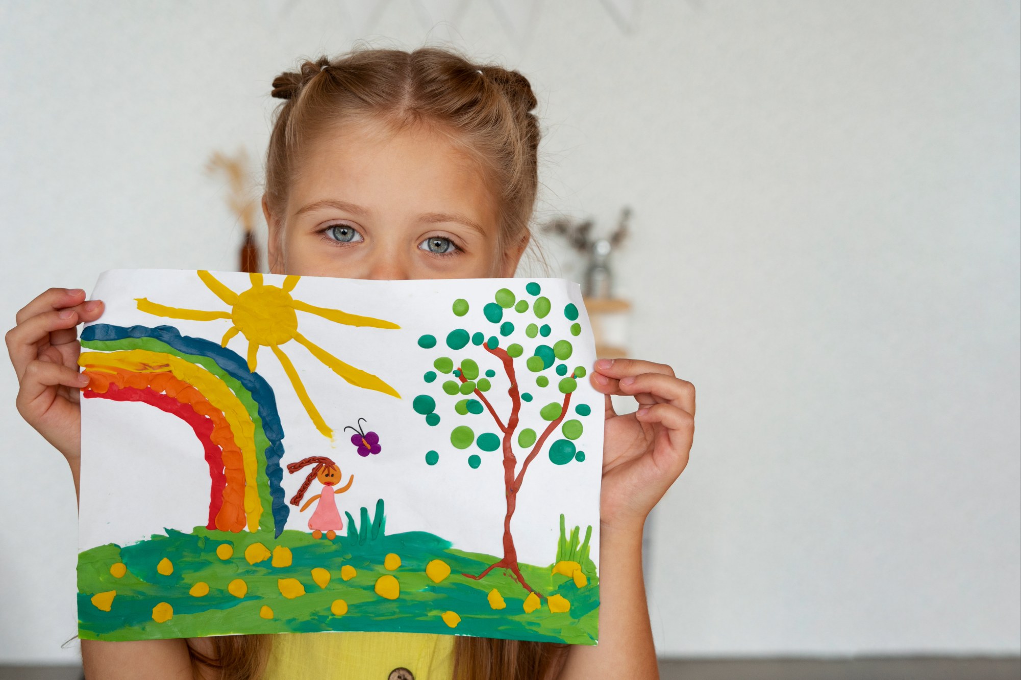 A child drawing at a table